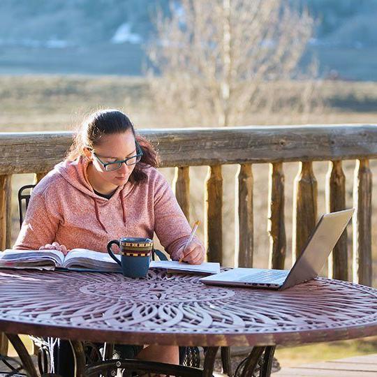 Woman using Viasat Internet to get work done